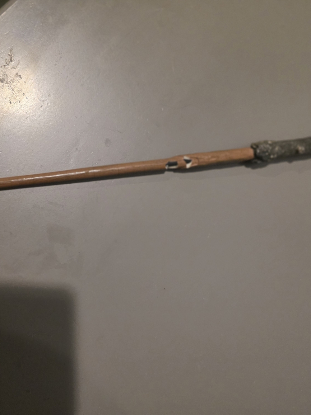 Wooden Wand with Dark Tip and Small Black & White Mark